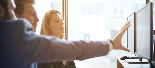 Image of employees working together in an office
