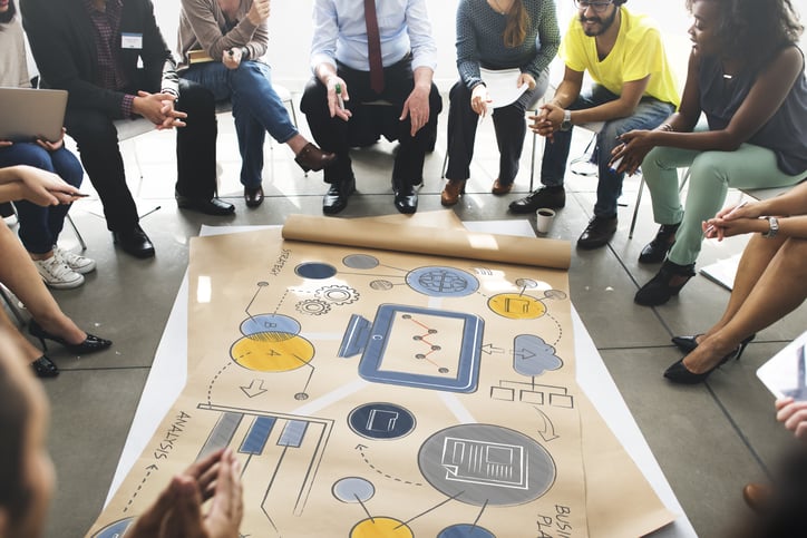 Image of employees discussing the right ERP that works for their organization