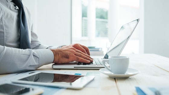 shutterstock_323689535 tech busy coffee desk.jpg