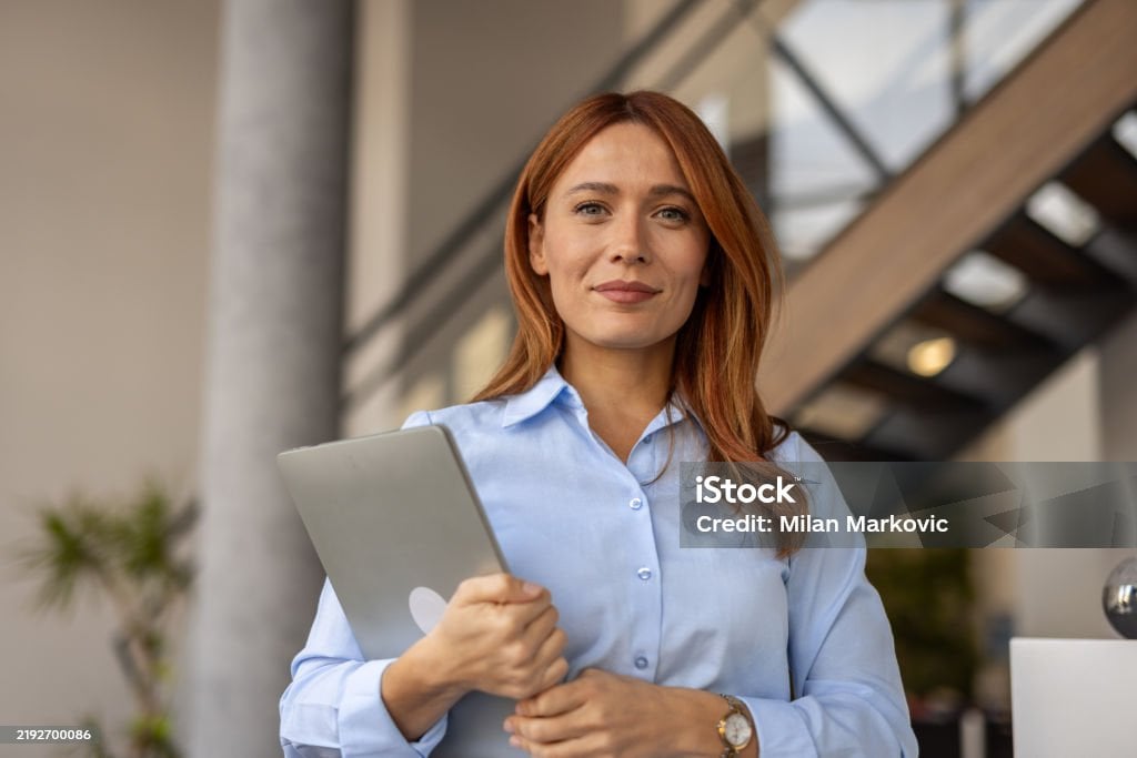 HR manager holding a laptop