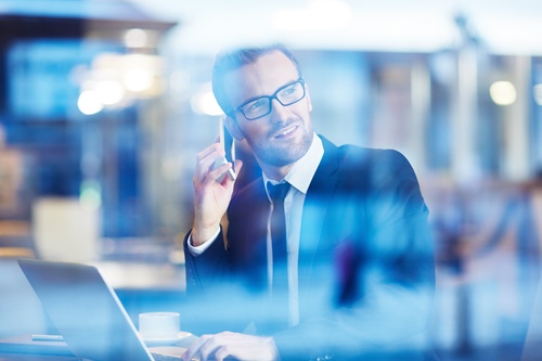 BI shutterstock_364573193 lone office busy phone.jpg